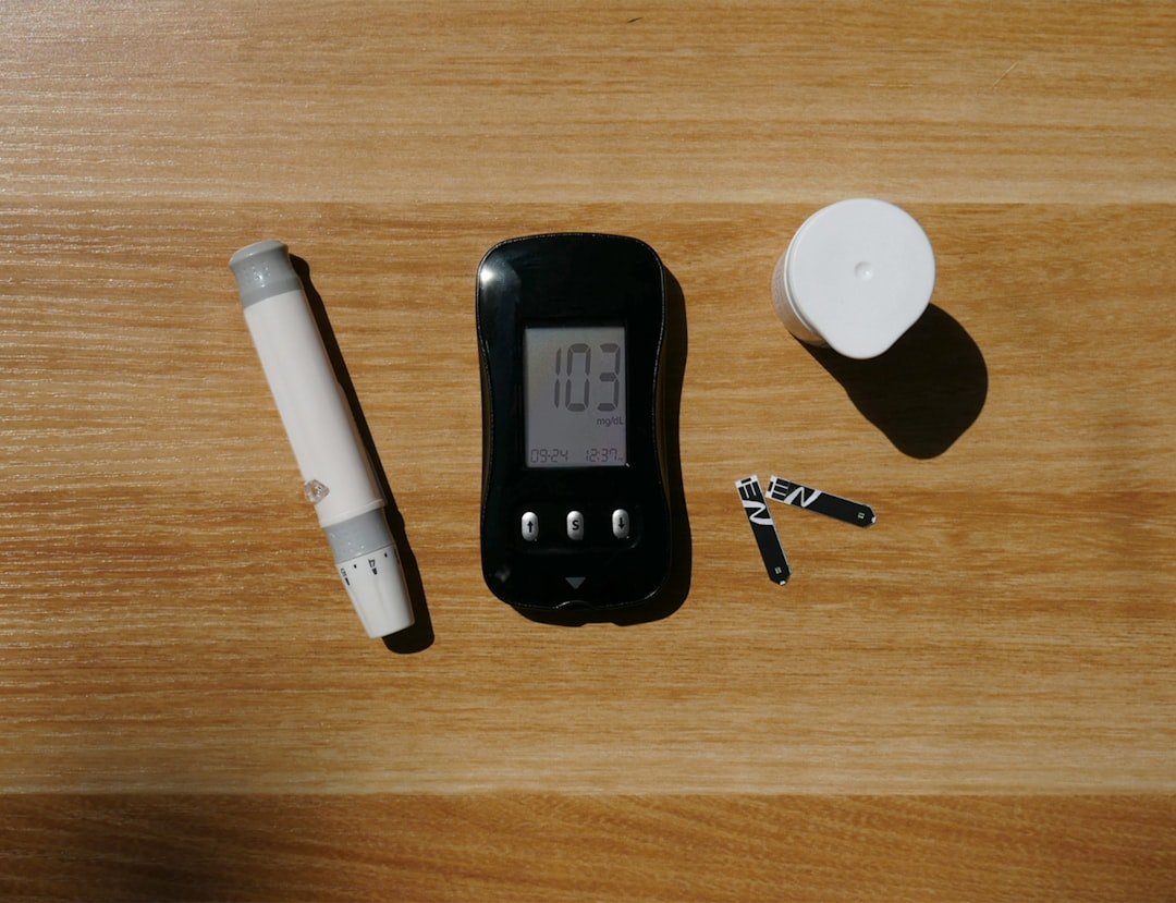 Basic home energy audit tools laid out including flashlight, notebook, infrared thermometer, and weatherstripping