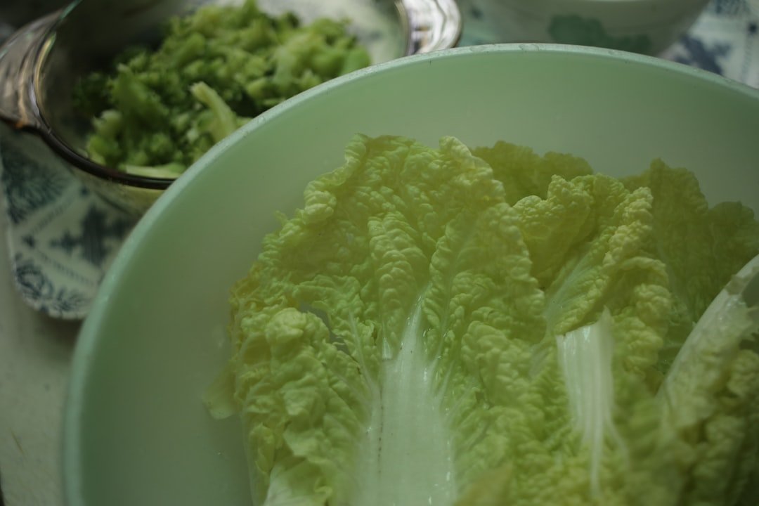 Step-by-step process of making sauerkraut from cabbage scraps showing salting, massaging, packing into jars, and the finished fermented product